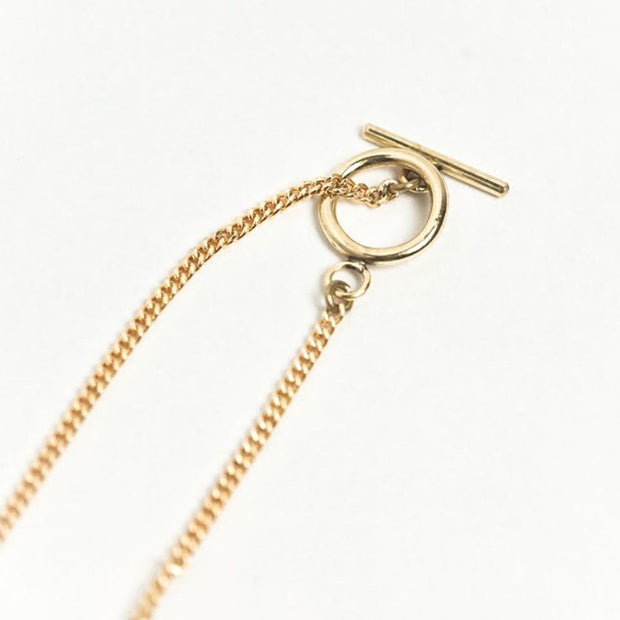 Halo Brass Pendant Necklace showing toggle closure