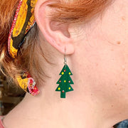 Hand-Painted Tin Christmas Tree Earrings on model