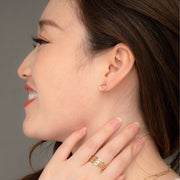 Halo Gold Stud Earrings on model