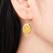 In Bloom Drop Earrings with Real Yellow Flowers encased in clear resin on model