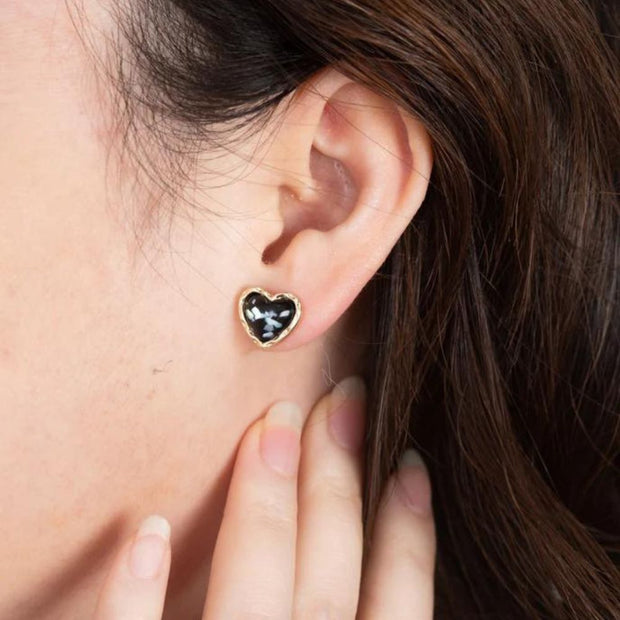 Glitter Gold and Black Heart Stud Earrings on model