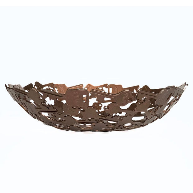 Antiqued copper-colored metal bowl made of assorted recycled iron keys side view