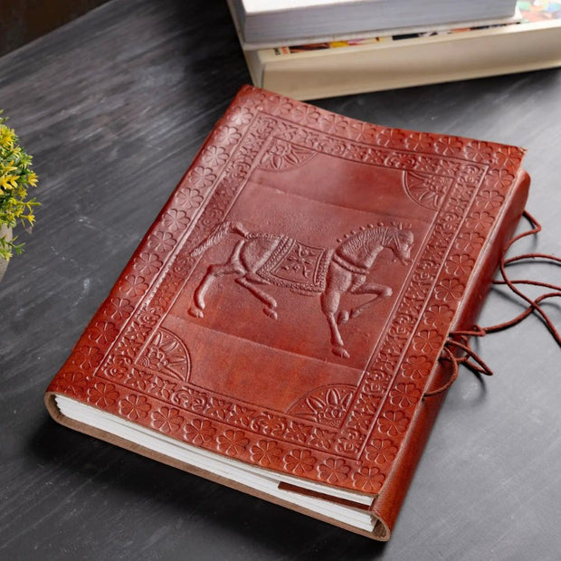 7" x 10" Embossed Equestrian Motif Leather Journal styled on a desk