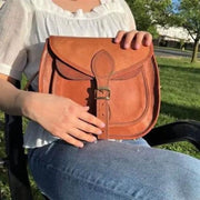 Rustic Goat Leather Crossbody Satchel Bag on model's lap