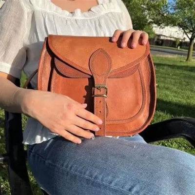 Rustic Goat Leather Crossbody Satchel Bag on model's lap