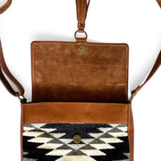 Heritage Tapiz-style Weave and Leather Crossbody Bag open to show magnetic closure and tassel