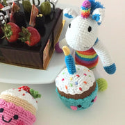 Mini Plush Rainbow Unicorn Rattle styled with cupcake rattle