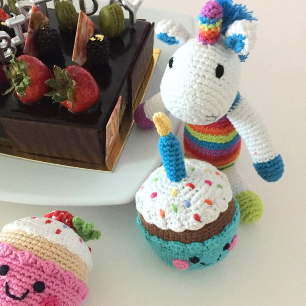 Mini Plush Rainbow Unicorn Rattle styled with cupcake rattle