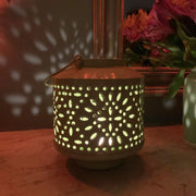 Celadon Green Garden Party Indoor or Outdoor Tealight Lantern shown in the dark with candle inside