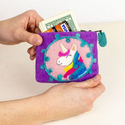 Person holding a Purple Felted Wool Coin Purse or pouch featuring a Unicorn head and showing cash and credit cards