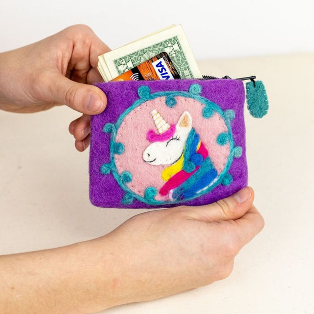 Person holding a Purple Felted Wool Coin Purse or pouch featuring a Unicorn head and showing cash and credit cards