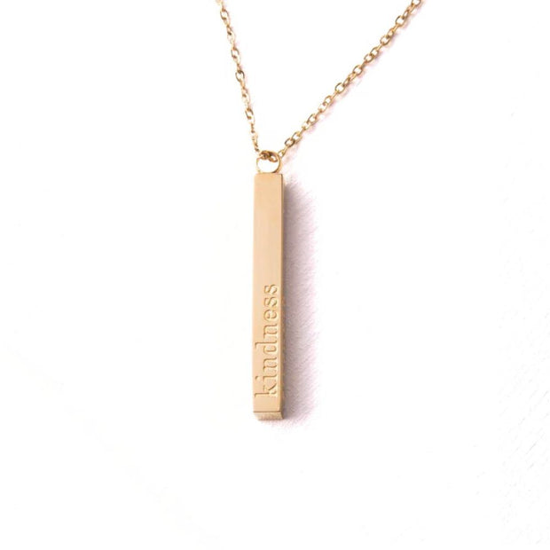 Strength Bar Necklace displaying the word kindness