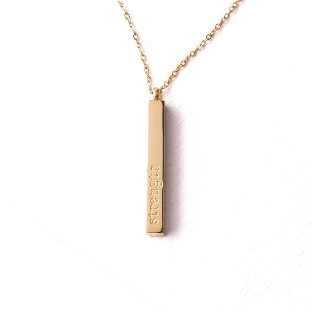 Strength Bar Necklace displaying the word strength