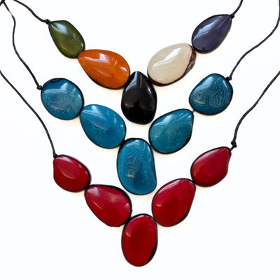 Cinco Tagua Necklaces showing three different color options