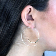Sterling Silver and 14k gold Minimalist Open Hoop Spiral Rip Curl Earrings on model