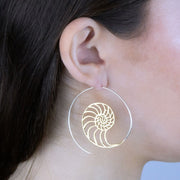 Sterling Silver and 14k gold Spiral Mermaid's Call Open Hoop Earrings on model