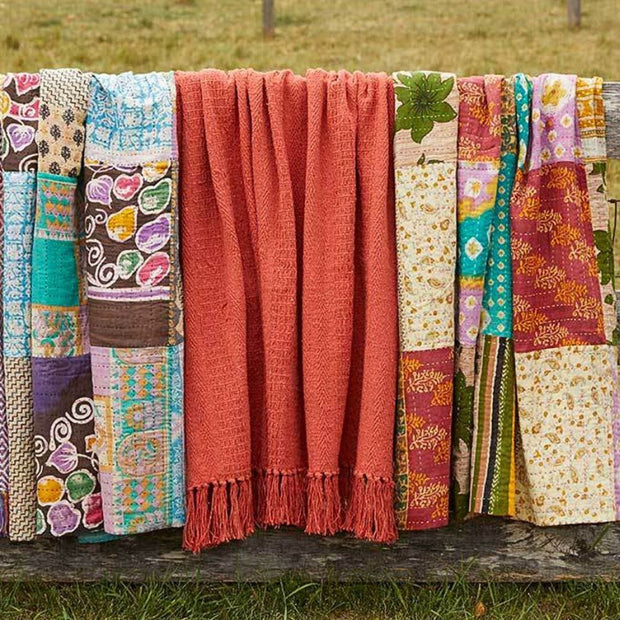 60" x 50" Rethread Throw - Brick Orange hanging with Kantha patchwork blankets