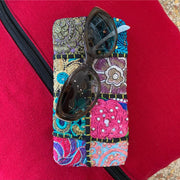 Recycled Sari Patchwork Eyeglass Case shown with sunglasses