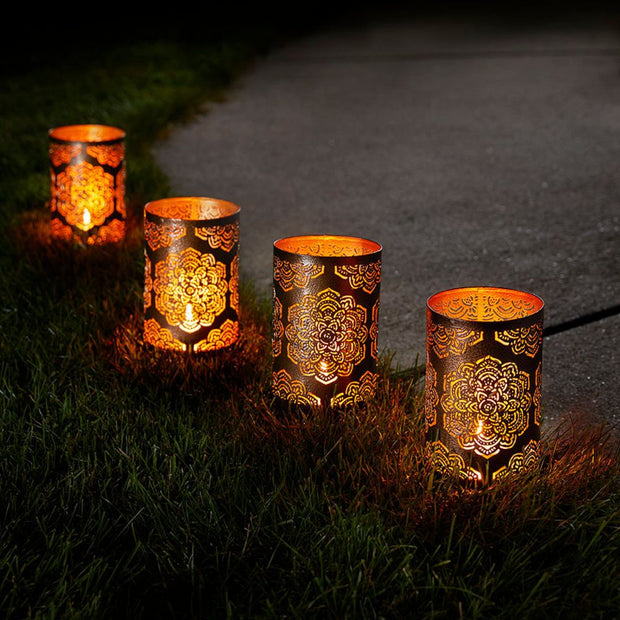 Waterproof Mandala Iron Lantern Stake shown lighting up a walkway