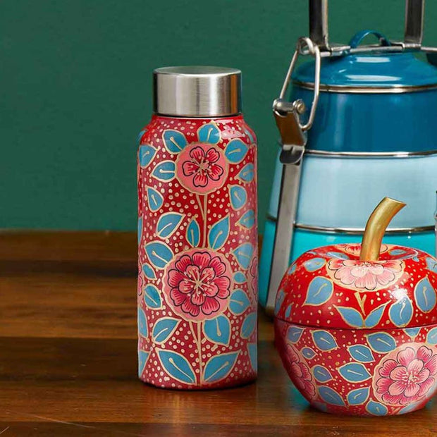 Stainless Steel Hand-painted Apple Blossom Kashmiri Water Bottle next to a tiffin