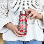 Person holding a Stainless Steel Hand-painted Apple Blossom Kashmiri Water Bottle