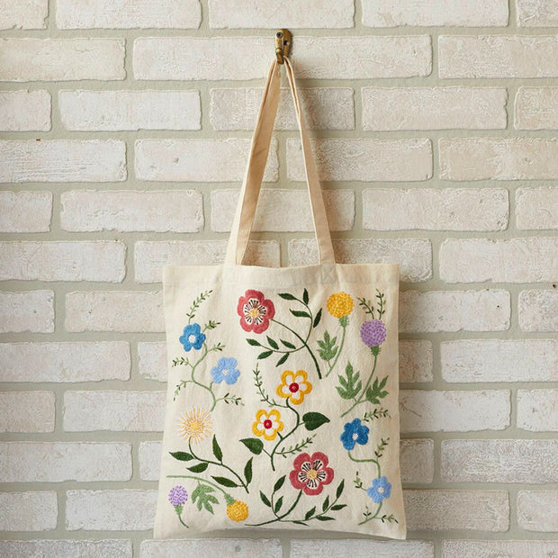 Wildflower Embroidered Tote hanging on wall