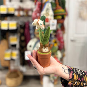 Person holding a Potted Plant featuring Felted Snow Drop Blossom