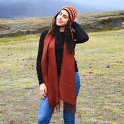 Woman wearing a Solid color 100% Alpaca Fiber Fringed Scarf in Burnt Orange