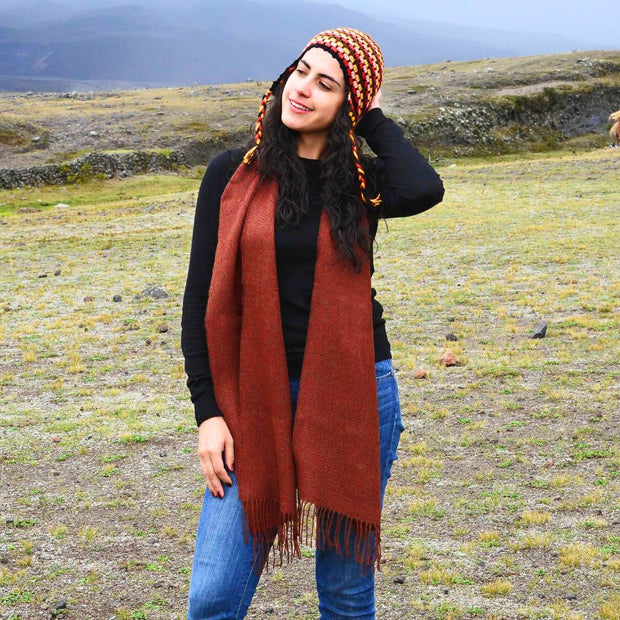 Woman wearing a Solid color 100% Alpaca Fiber Fringed Scarf in Burnt Orange
