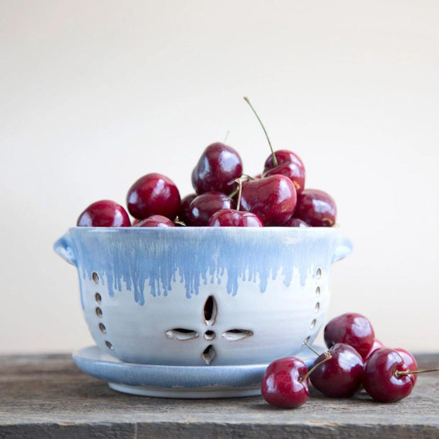 Bowl of Berries Ceramic Colander filled with cherries