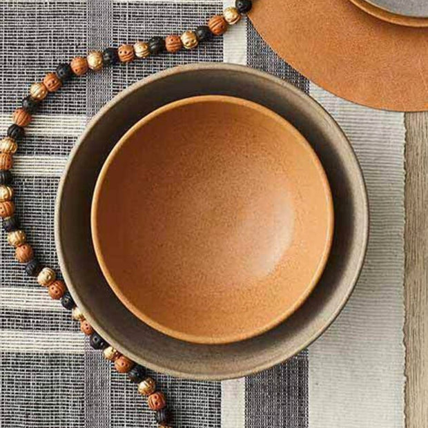 Warm Amber and Stone Gray Dhabba Stoneware Ceramic Mixing Bowls nested on table setting