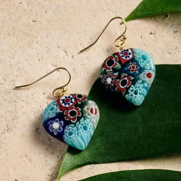 Heart Shaped Raza Murano Millefiori Drop Earrings styled on textured surface