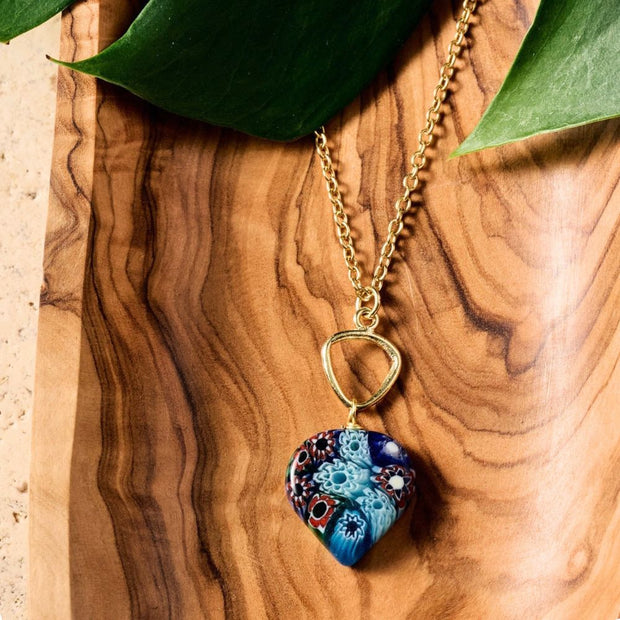 Heart Shaped Raza Murano Millefiori Pendant Necklace styled on wooden surface