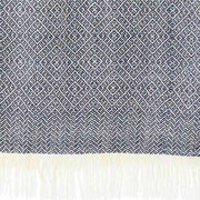 Blue and White Diamond Isla Alpaca Throw Blanket showing weave detail and fringed ends