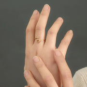 Ada Adjustable Gold ring with a heart design on a hand