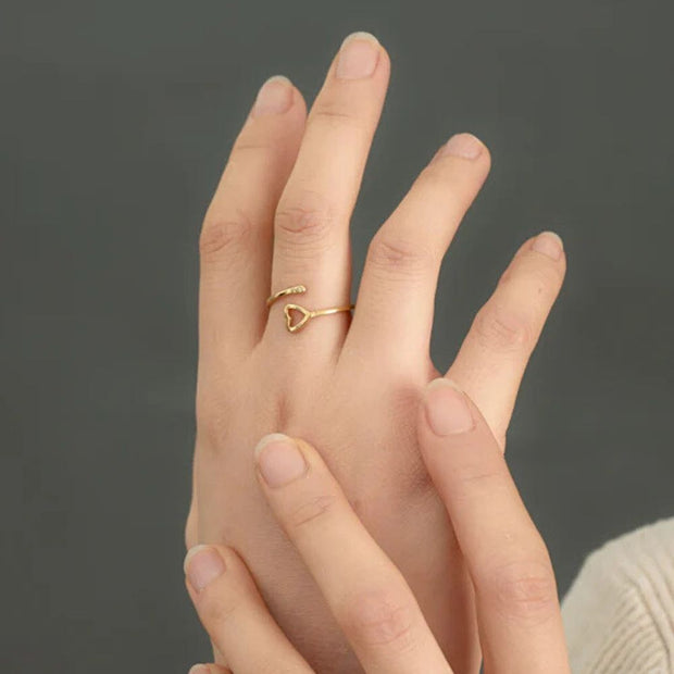 Ada Adjustable Gold ring with a heart design on a hand