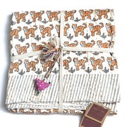 Block Printed Kantha Baby Quilt folded with allover Tigers ready to gift