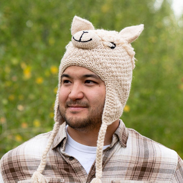 Adult Hand-knit Animal Face Hat depicting an Alpaca on male model