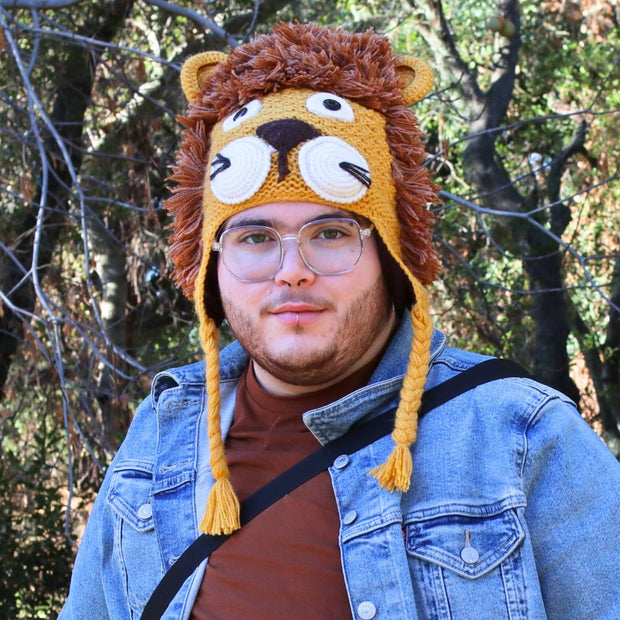 Person wearing a Lion-themed Adult Hand-knit Alpaca Blended Winter Hat with ear flaps