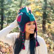 Woman wearing an Adult Hand-knit Adventure Hat depicting a Dragon