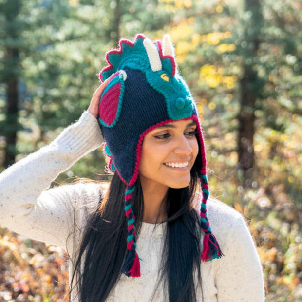 Woman wearing an Adult Hand-knit Adventure Hat depicting a Dragon
