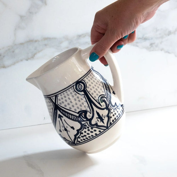 Haqima Hand-painted Ceramic Pitcher held by model