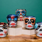 Assortment of various Hand-painted La Catrina Sugar Skull Ceramic Mugs styled
