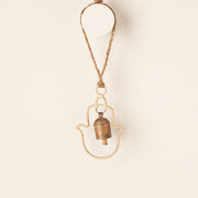 Hamsa Bell Wind Chime styled on a wall