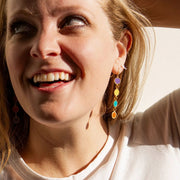 Model wearing Color Study Enamel Earrings in Gumdrop option