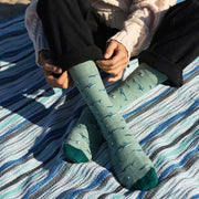 Person wearing Conscious Step Socks that Protect Whales