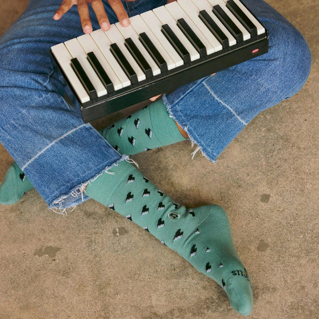 Conscious Step Gift Box - Socks That Support Music on model showing one design