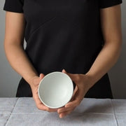 Stoneware Condiment Bowl Dadasi 6 oz Matte White held by model