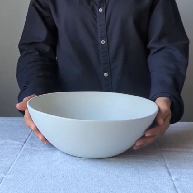 Stoneware Large Serving Bowl Dadasi 11.8" Matte White held by model