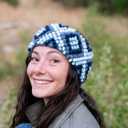 Model wearing a Diamond Hand-knit Ear Warmer in Nordic colors